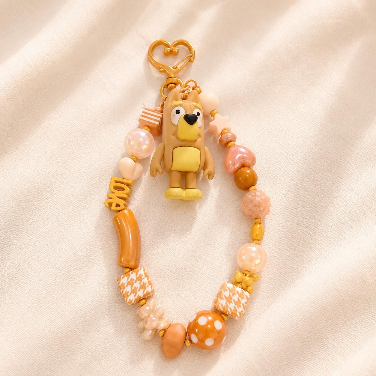 Attache téléphone Kawaii ocre avec figurine chien
